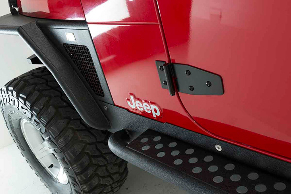 Installed Kentrol T-304 stainless steel hinges for Jeep Wrangler TJ, showcasing the black powder coated stainless steel 
