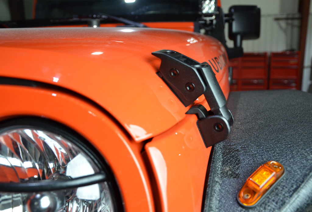 Close-up shot of the Kentrol Hood Catch Kit for 2007-2018 Jeep Wrangler 80704 installed to the vehicle