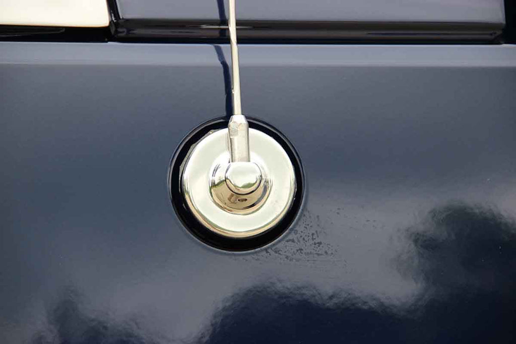 Installed Kentrol T-304 stainless-steel antenna cover for Jeep JK, showcasing the polished stainless-steel