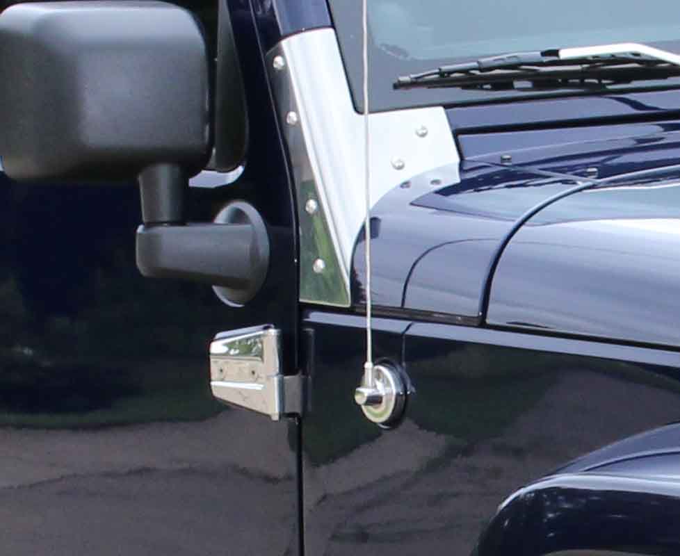 Installed Kentrol T-304 stainless-steel antenna cover for Jeep JK, showcasing the polished stainless-steel