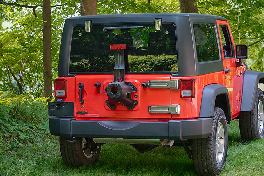 Installed Kentrol T-304 stainless-steel liftgate hinges for Jeep Wrangler JK, showcasing the polished stainless-steel