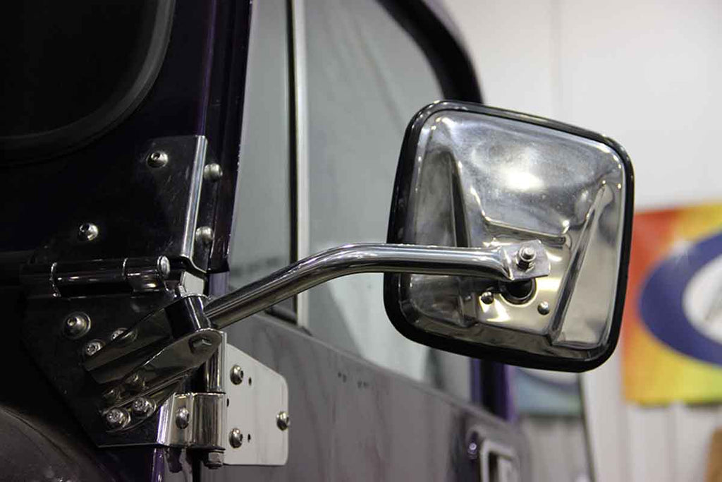 Installed Kentrol T-304 stainless steel hinges for Jeep Wrangler YJ and CJ, showcasing the polished stainless steel 