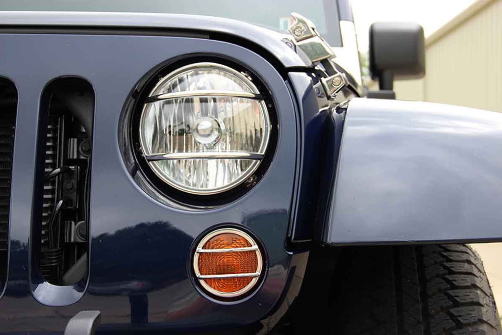 One of the two Kentrol Euro Headlight Guards for 2007-2018 Jeep Wrangler 30573 installed to the vehicle