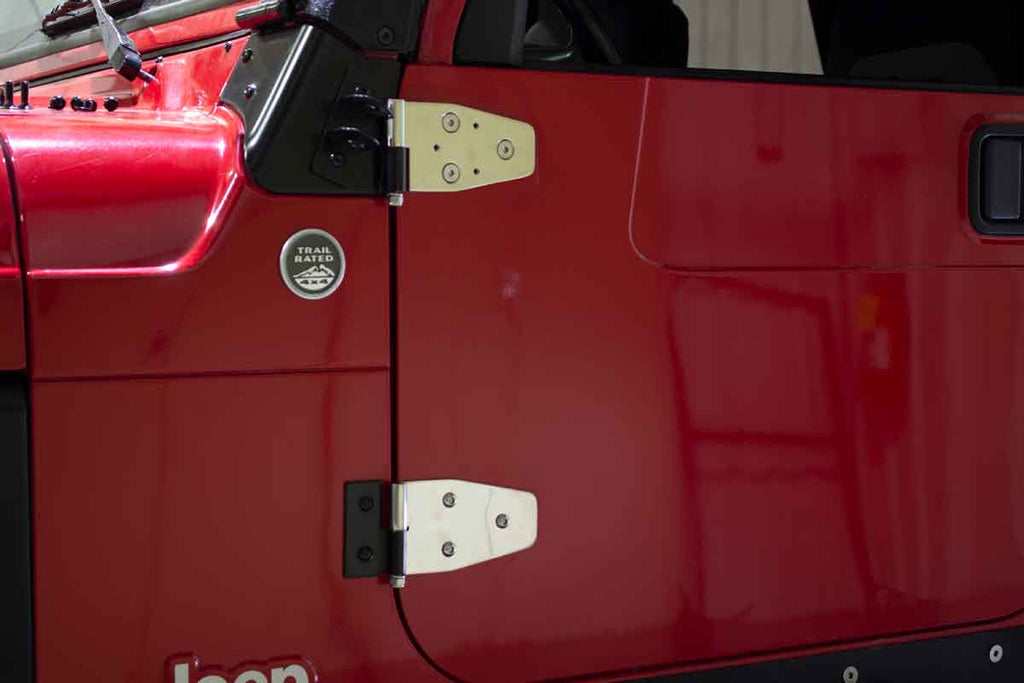 Wide angle of two hinges from the Kentrol Door Hinge Set 2003-2006 Jeep Wrangler 30719 installed to the vehicle