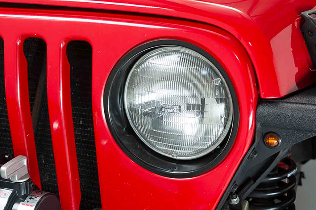 One of the two Kentrol Headlight Bezels for 1997-2006 Jeep Wrangler 50543 installed to the vehicle