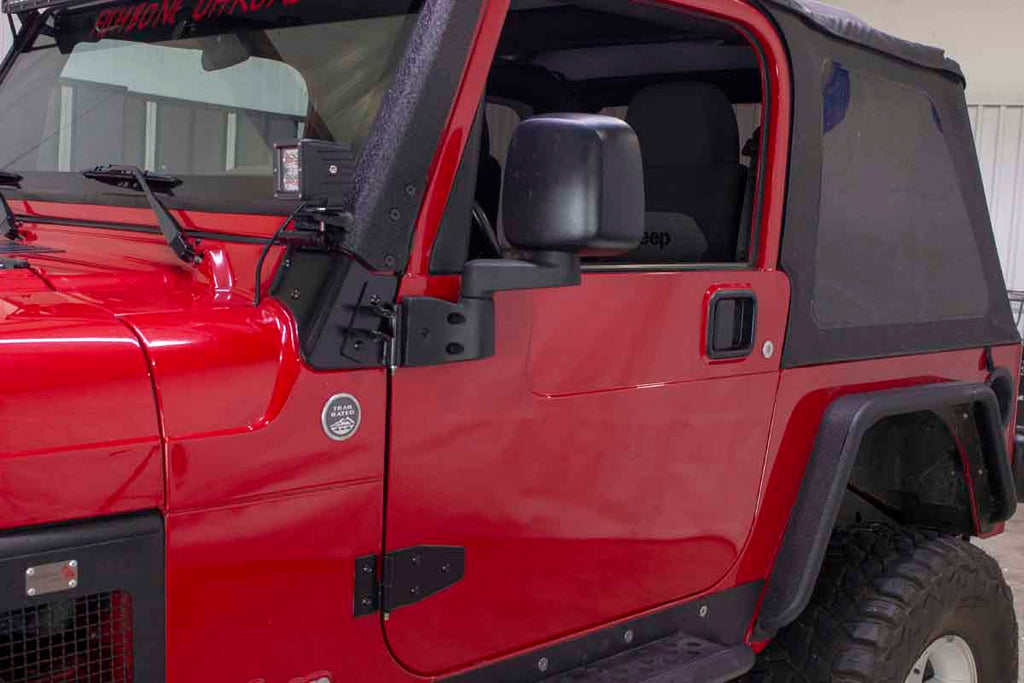 Side view showing two of four hinges in the Kentrol Door Hinge Set for 2003-2006 Jeep Wrangler 50719 installed to the vehicle's body