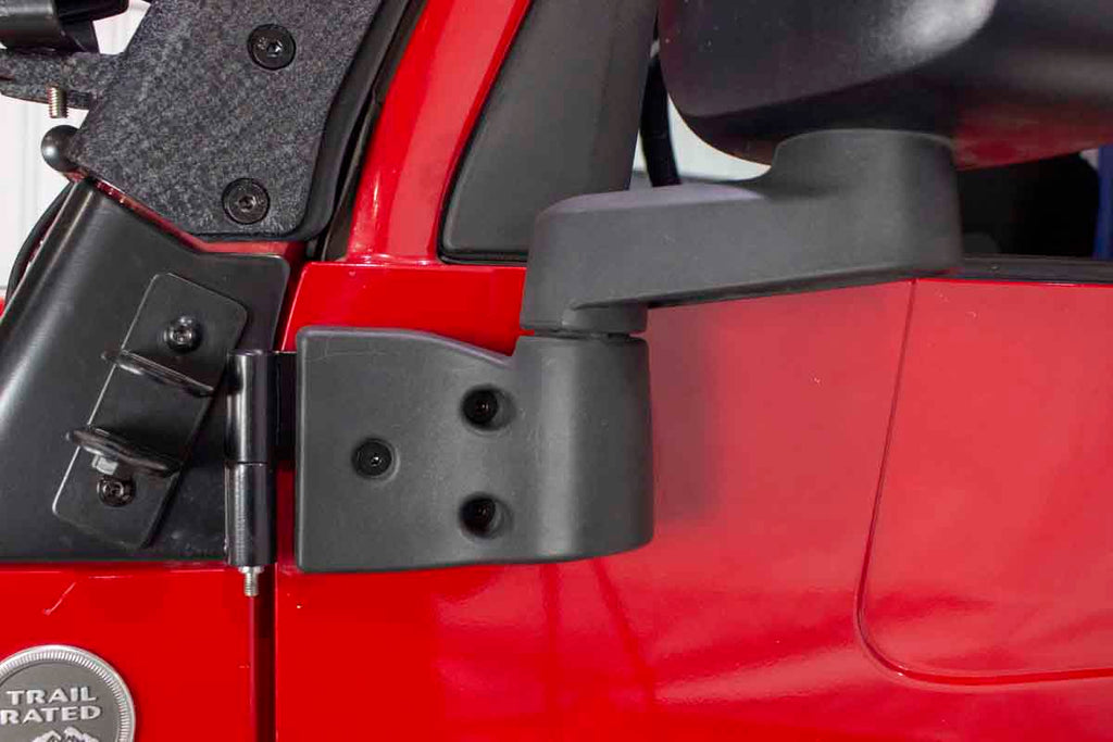 Mirror reinstalled over one of four of the Kentrol Door Hinge Set for 2003-2006 Jeep Wrangler 50719, installed to the vehicle's body