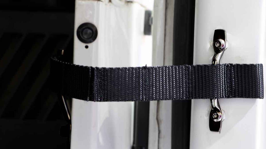 Close-up shot of the Kentrol Door Strap Kit for 1997-2006 Jeep Wrangler 50724 installed to the vehicle