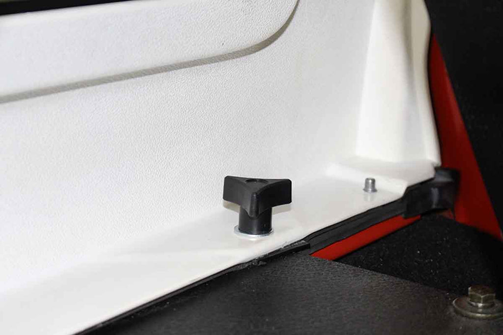 One of the six screws included in the Kentrol Hardtop Removal Kit 2007-2018 Jeep Wrangler 70009, installed to the vehicle