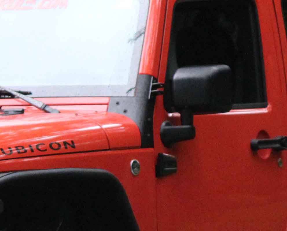 Close-up shot of the Kentrol Windshield Supports for 2007-2018 Jeep Wrangler 80574 installed to the vehicle
