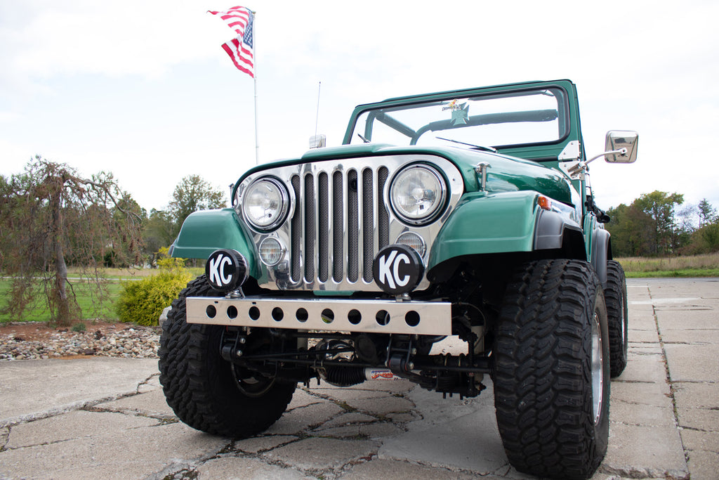 Side view of the Kentrol Front Bumper w/holes For 1955-1986 Jeep CJ 30429 installed to the vehicle